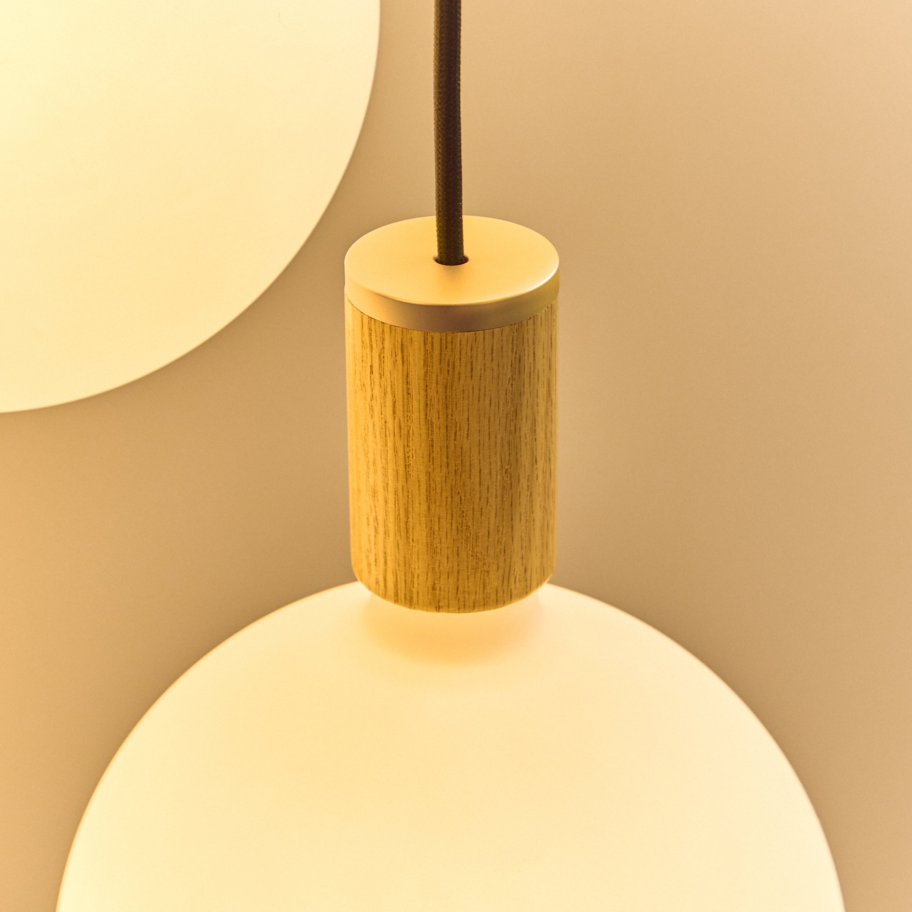 Tala Oval Dim-to-Warm Pendant Light in Oak close-up detail of the finish