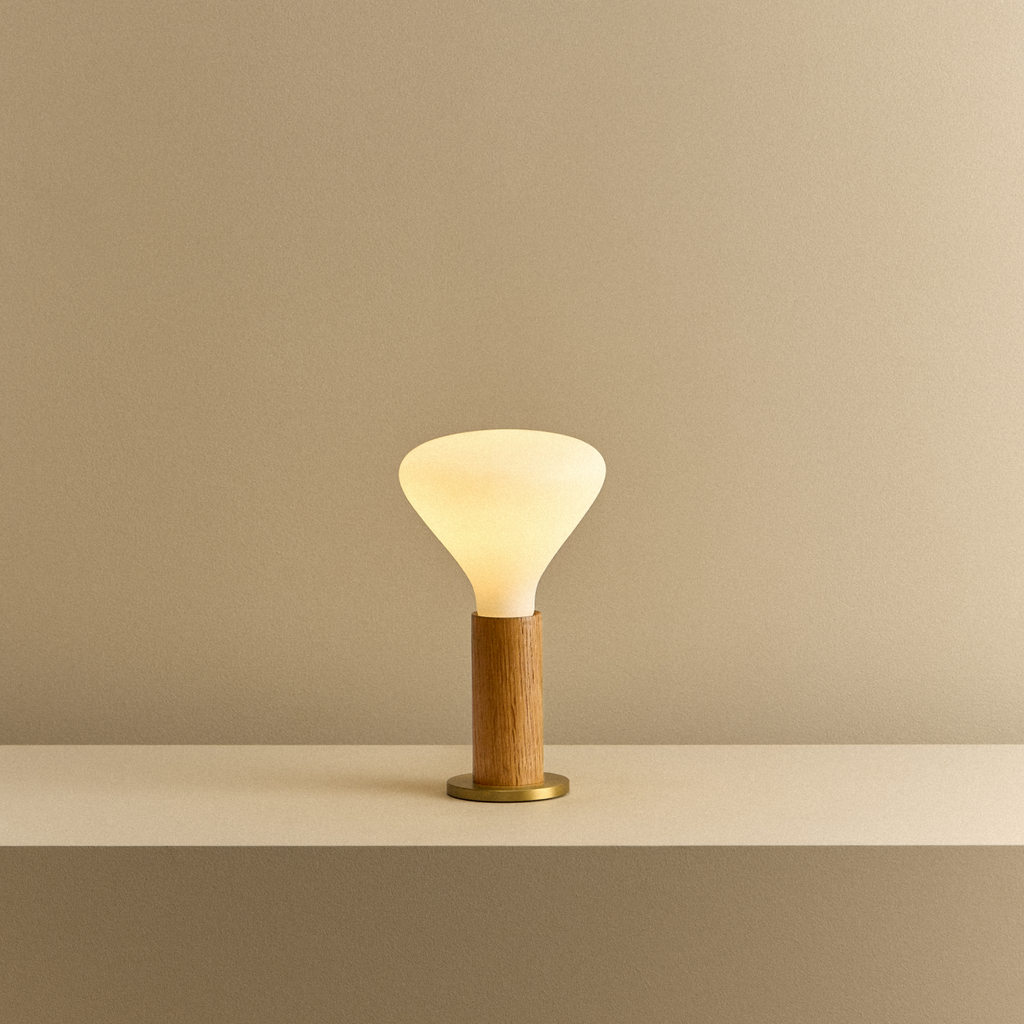 Tala Knuckle Table Lamp in Oak + Noma shown illuminated