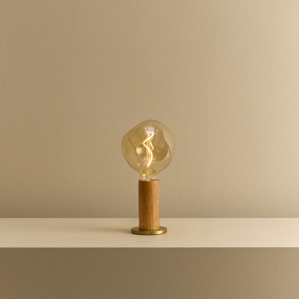 Tala Knuckle Table Lamp in Oak + Voronoi I shown illuminated