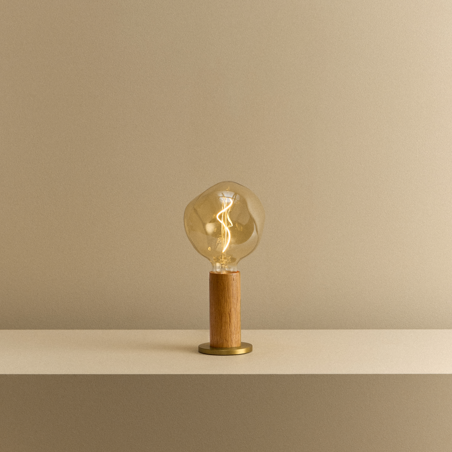 Tala Knuckle Table Lamp in Oak + Voronoi I shown illuminated
