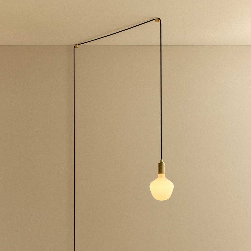 Tala Enno Plug-In Pendant in Brass shown illuminated