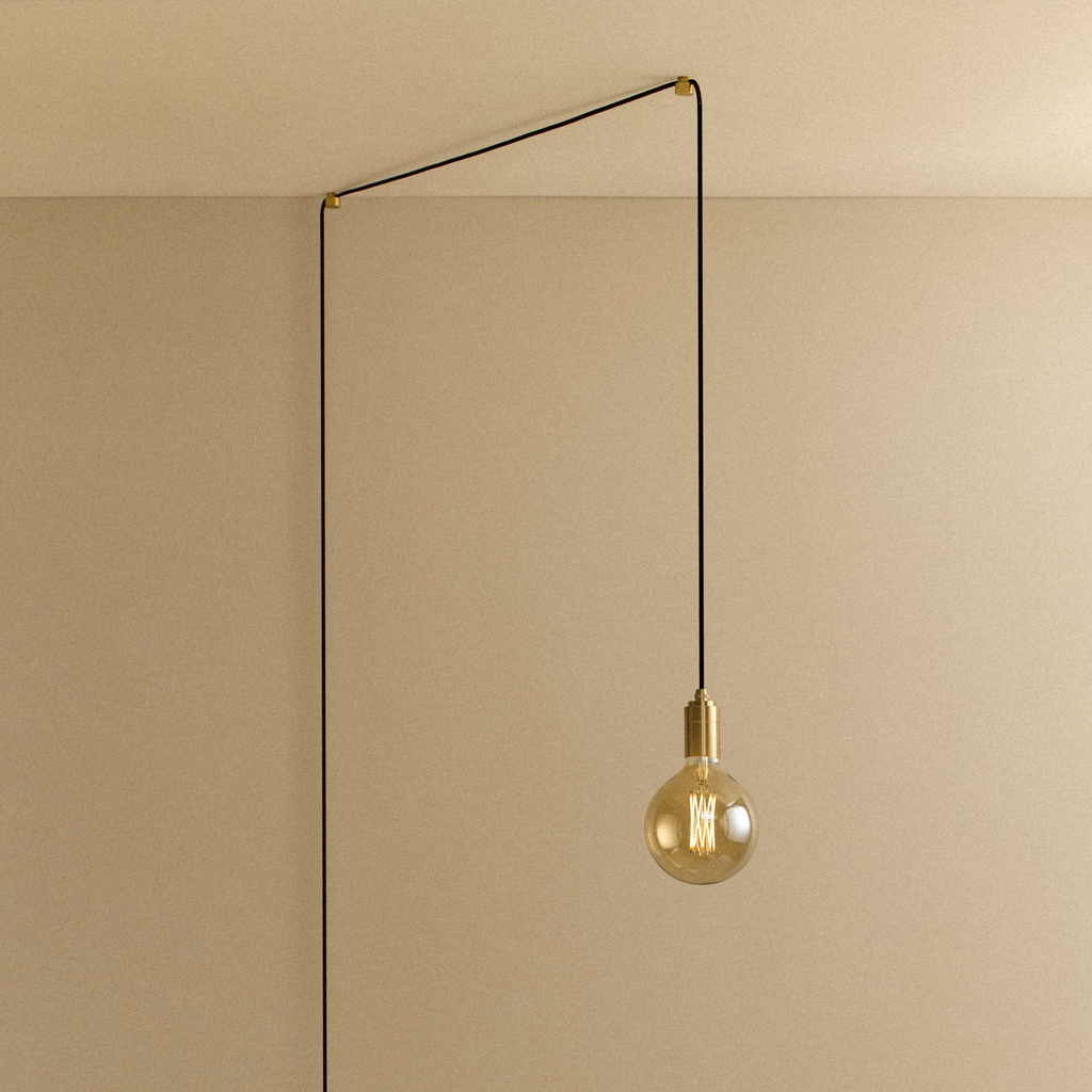 Tala Gaia Plug-In Pendant in Brass shown illuminated