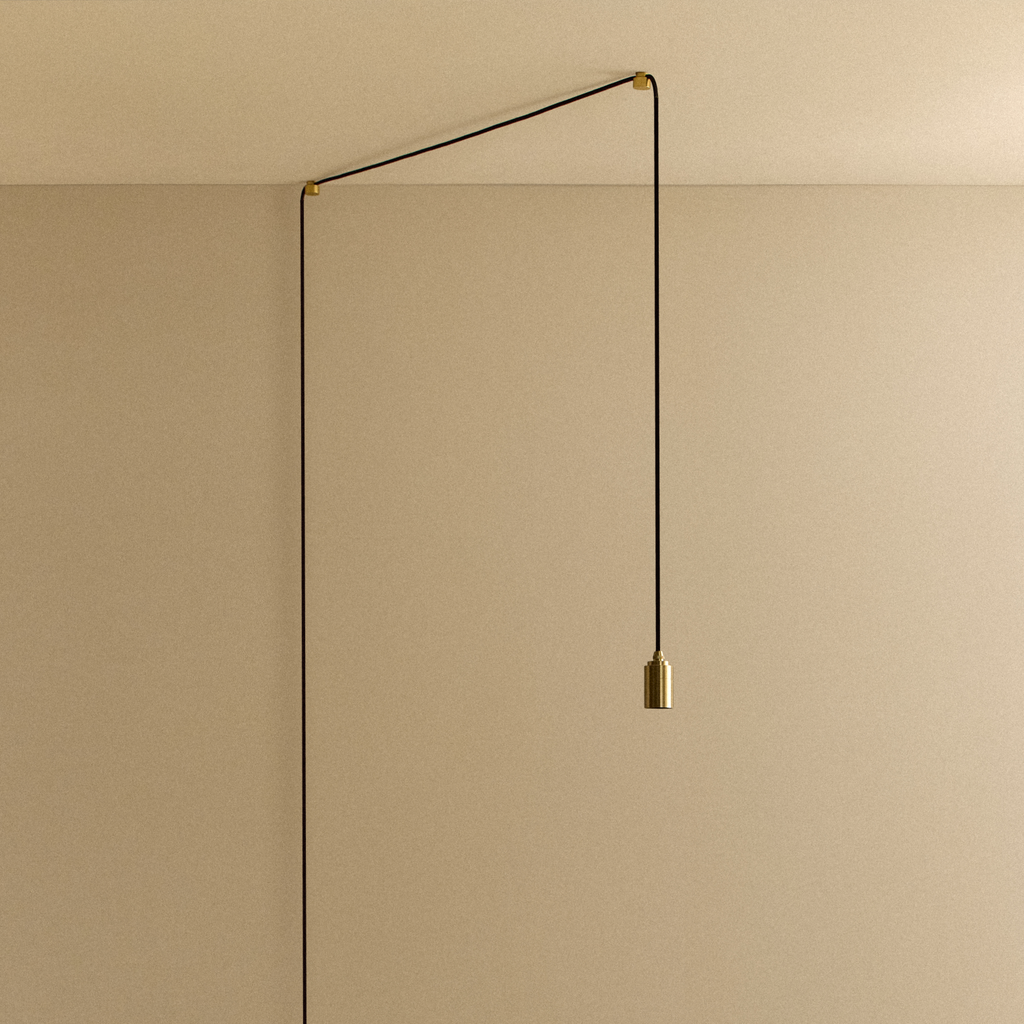 Tala Plug-In Pendant in Brass fixture shown without a bulb