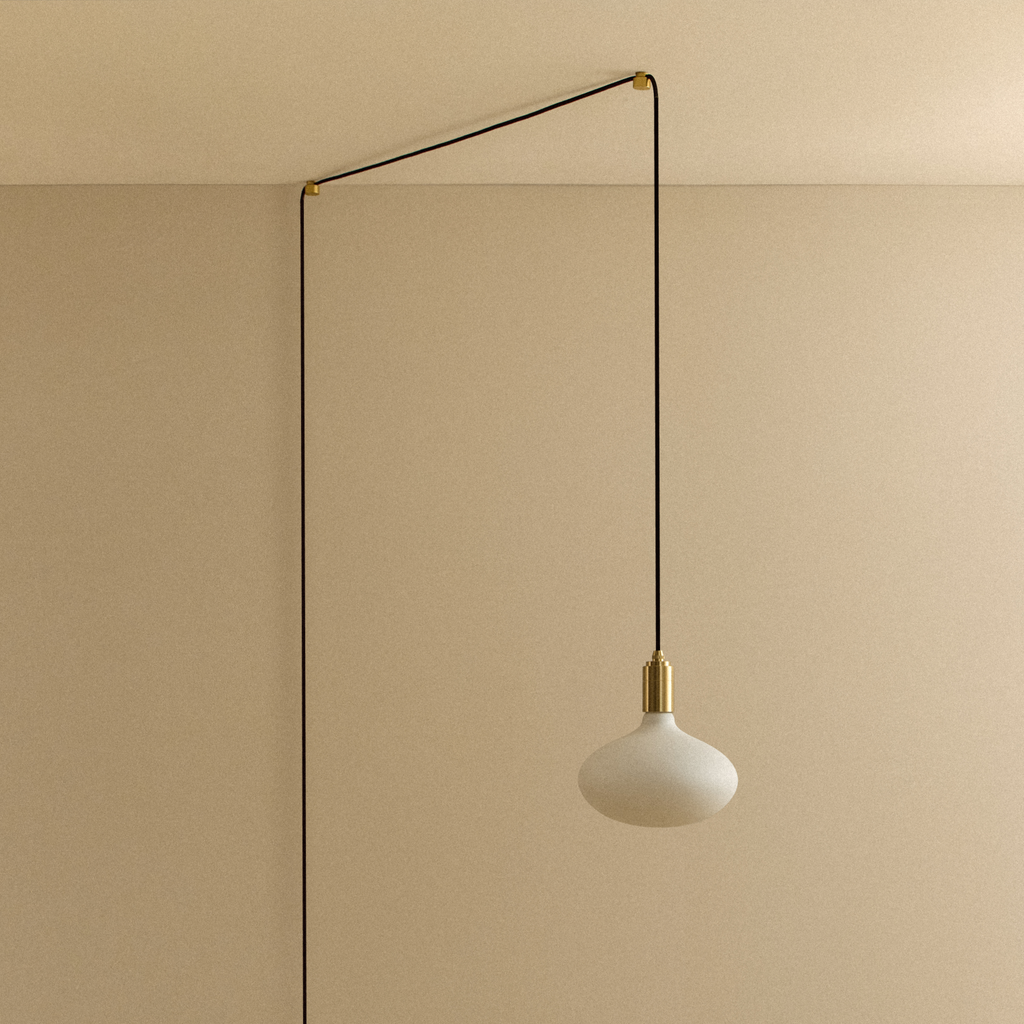 Tala Oval II Plug-In Pendant in Brass shown unlit