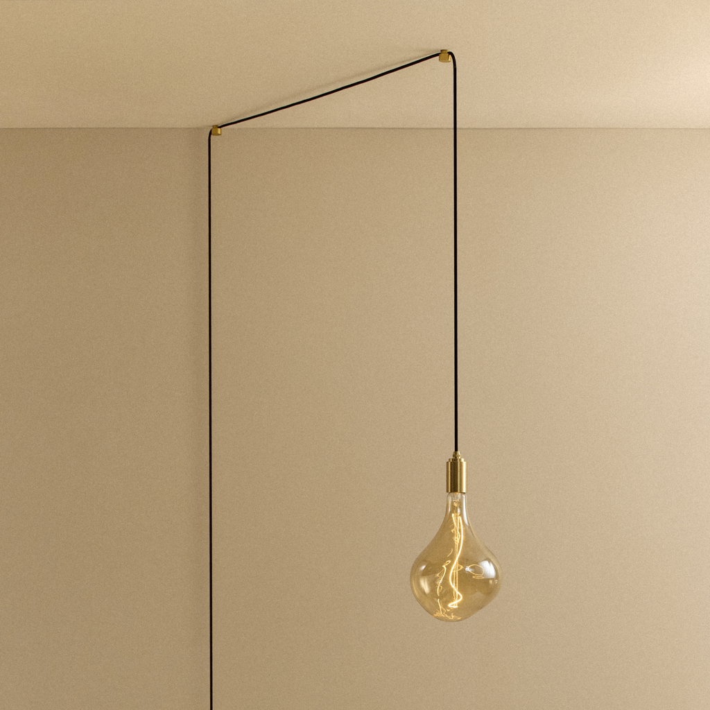 Tala Voronoi II Plug-In Pendant in Brass shown illuminated