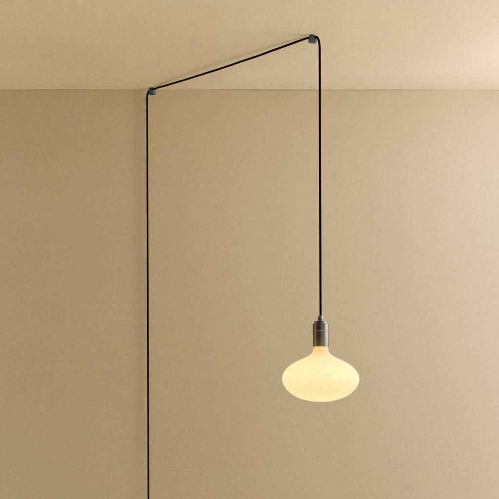 Tala Oval II Plug-In Pendant in Graphite shown illuminated