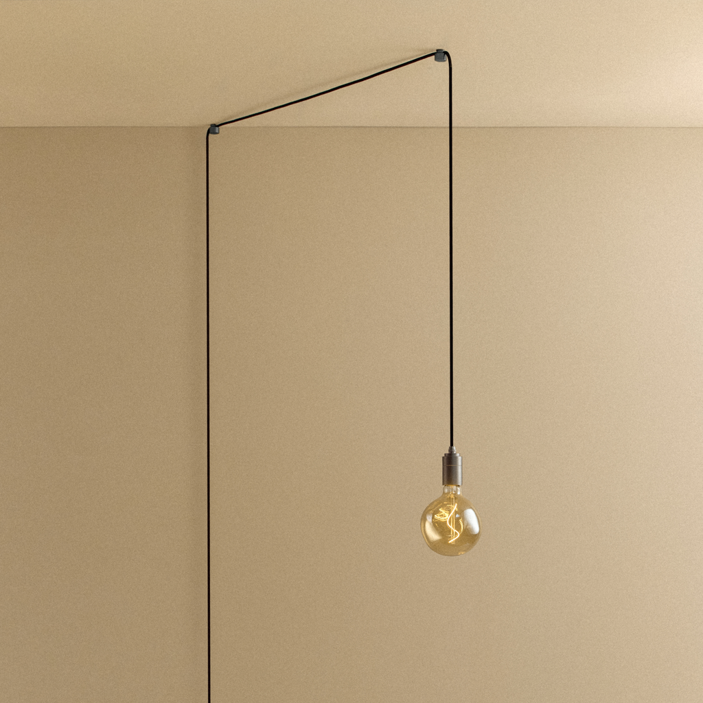 Tala Voronoi I Plug-In Pendant in Graphite shown illuminated