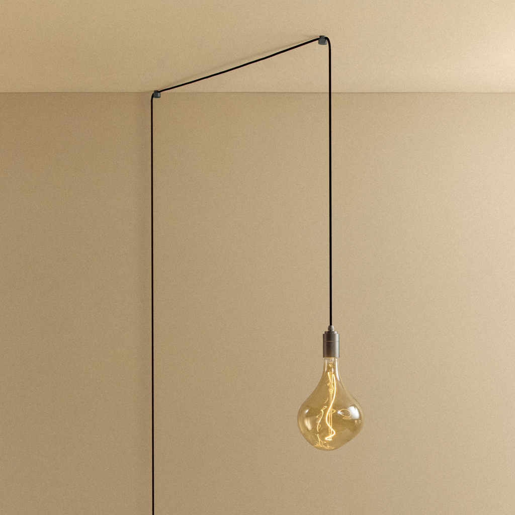 Tala Voronoi II Plug-In Pendant in Graphite shown illuminated