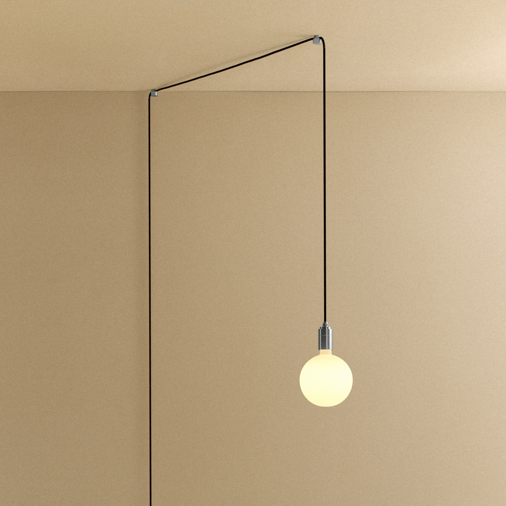 Tala Sphere IV Plug-In Pendant in Stainless Steel shown illuminated