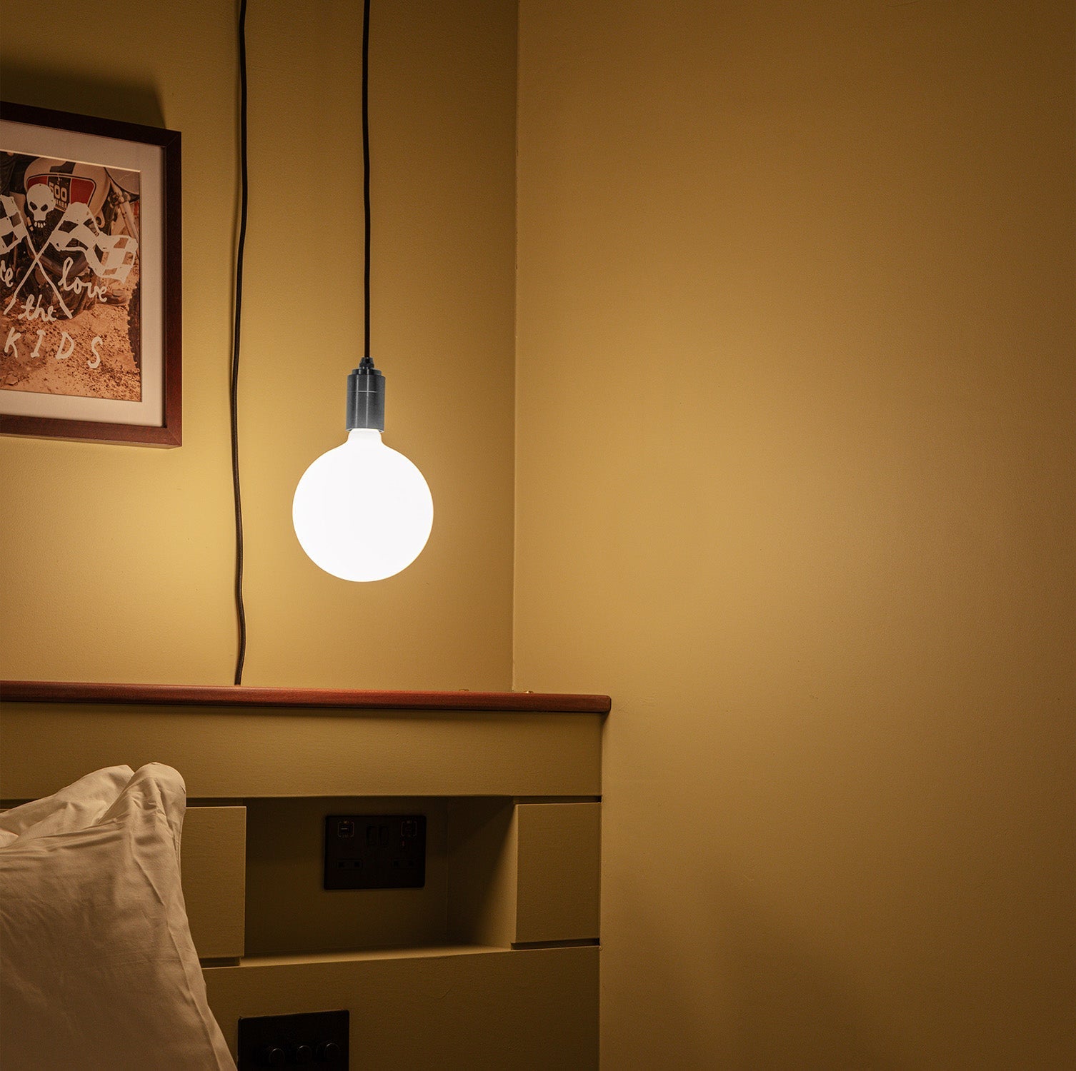 Tala Sphere IV Plug-In Pendant in Stainless Steel in a styled interior setting