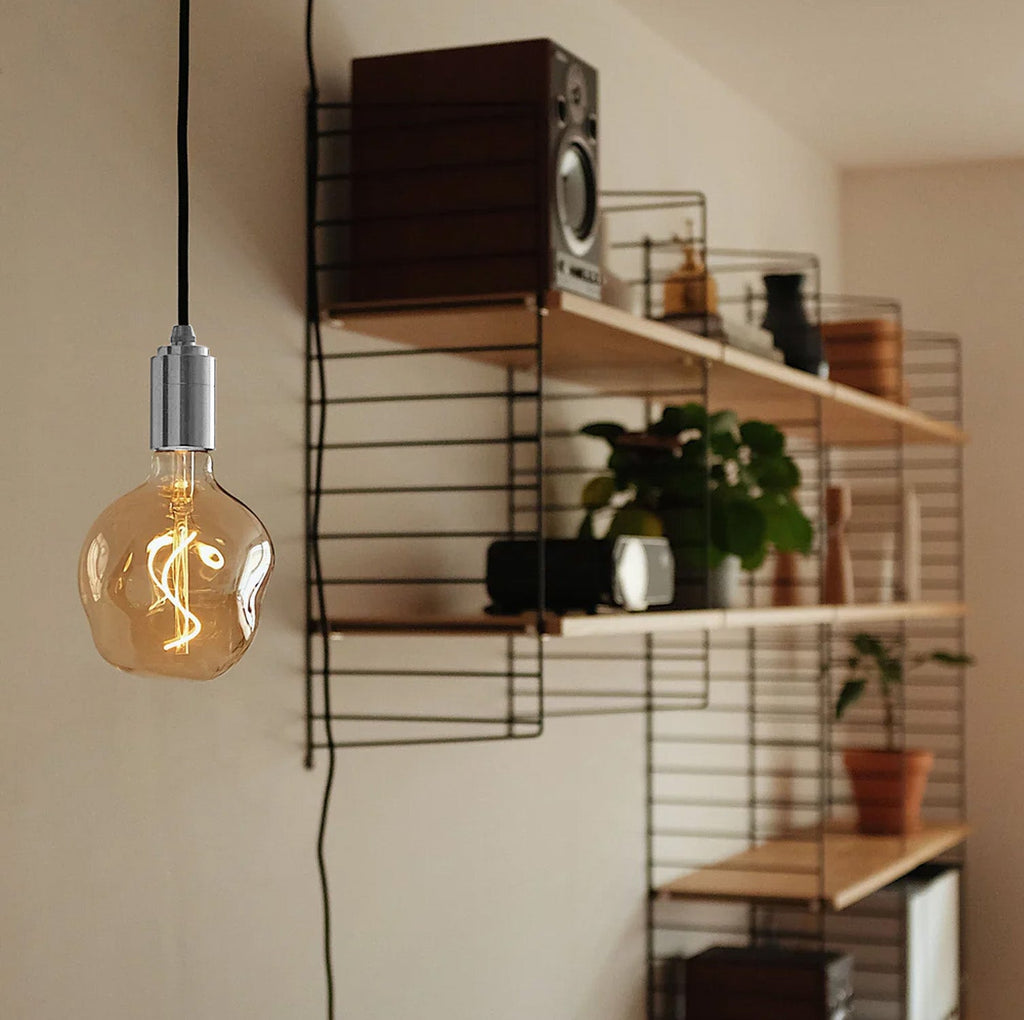 Tala Voronoi I Plug-In Pendant in Stainless Steel in a styled interior setting