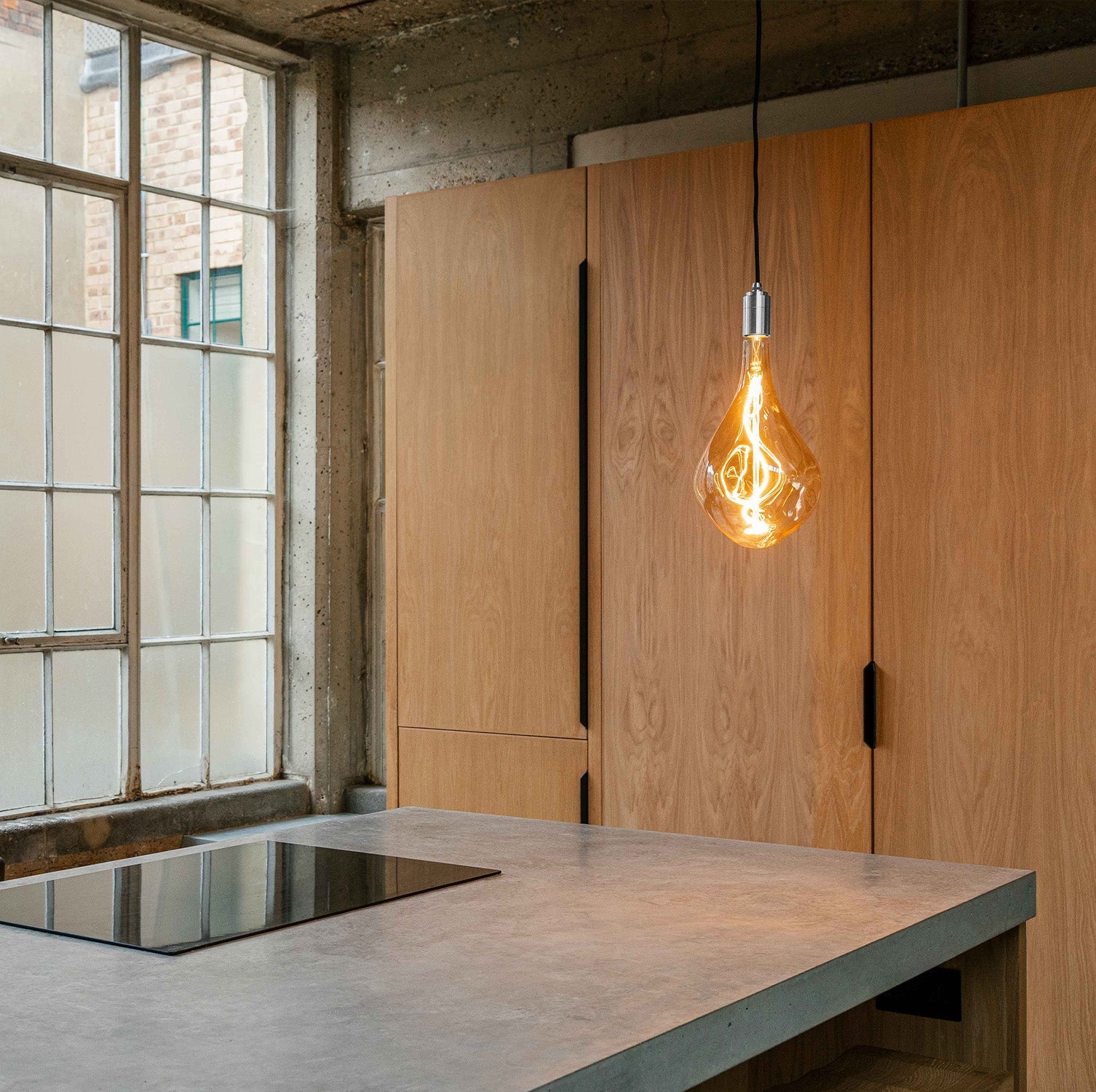 Tala Voronoi III Plug-In Pendant in Stainless Steel in a styled interior setting