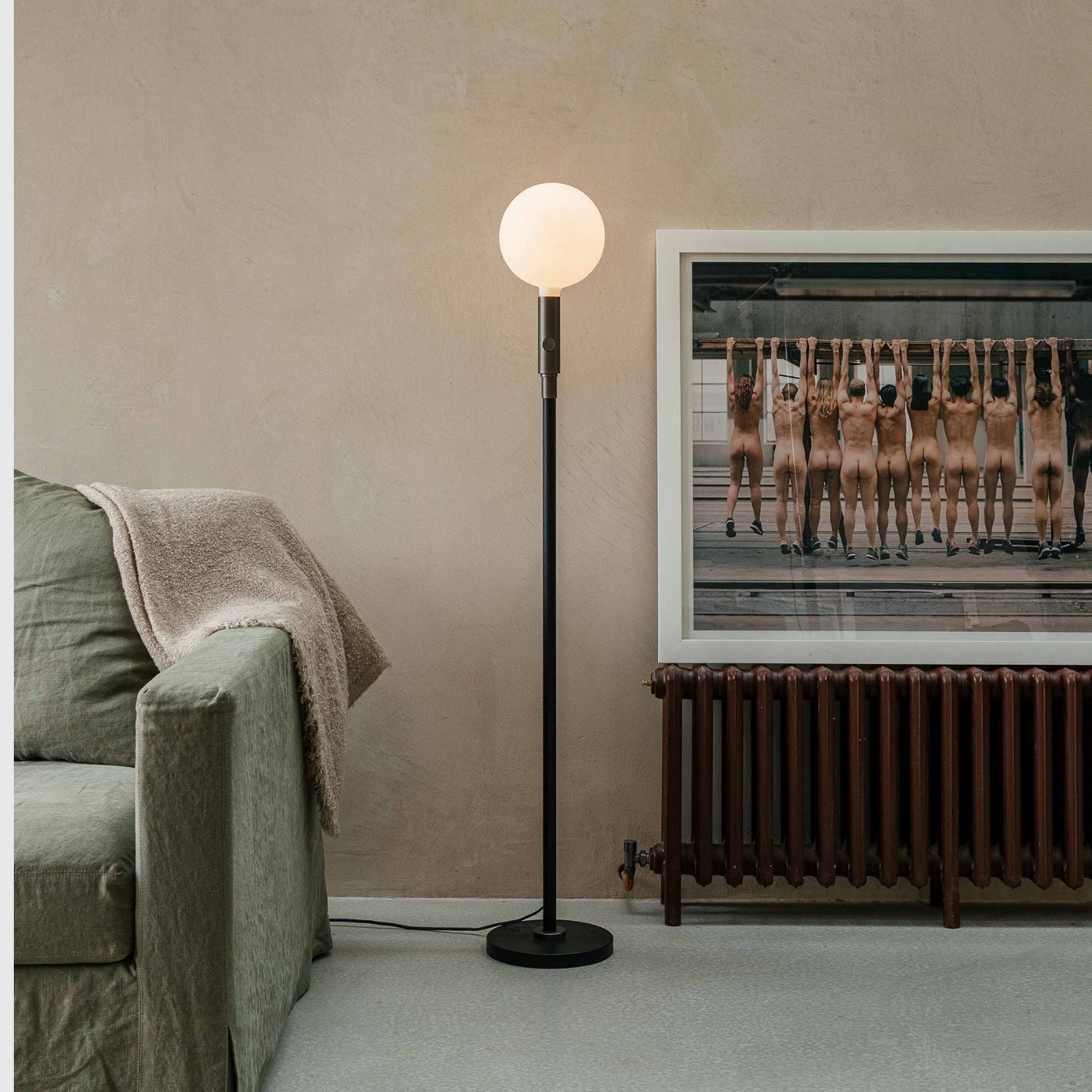 Tala Poise Adjustable Floor Lamp in Graphite in a styled interior setting