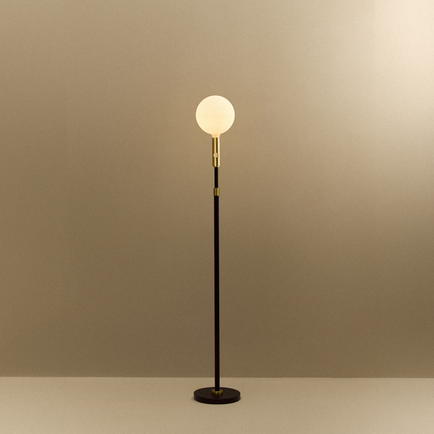 Tala Poise Adjustable Floor Lamp in Brass + Sphere V shown illuminated (view 2)