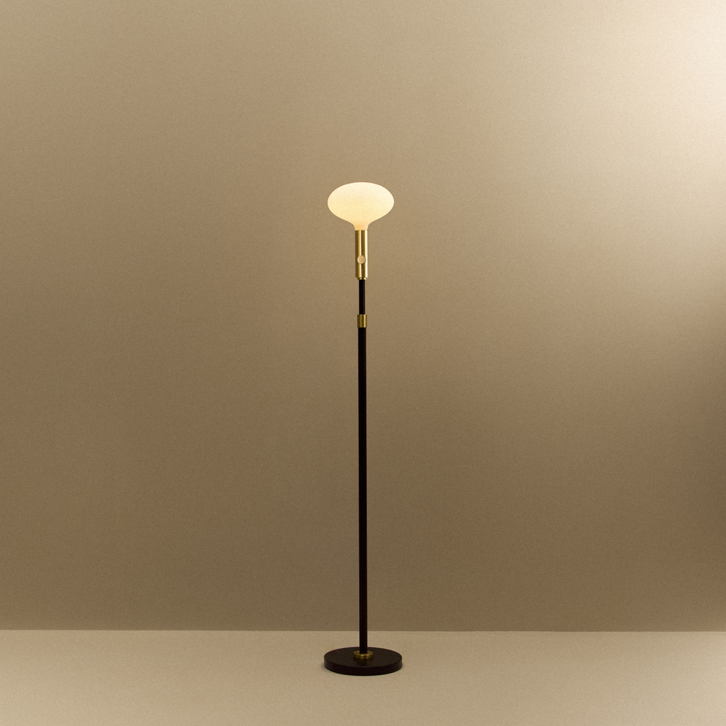 Tala Poise Adjustable Floor Lamp in Brass + Oval II shown illuminated (view 2)