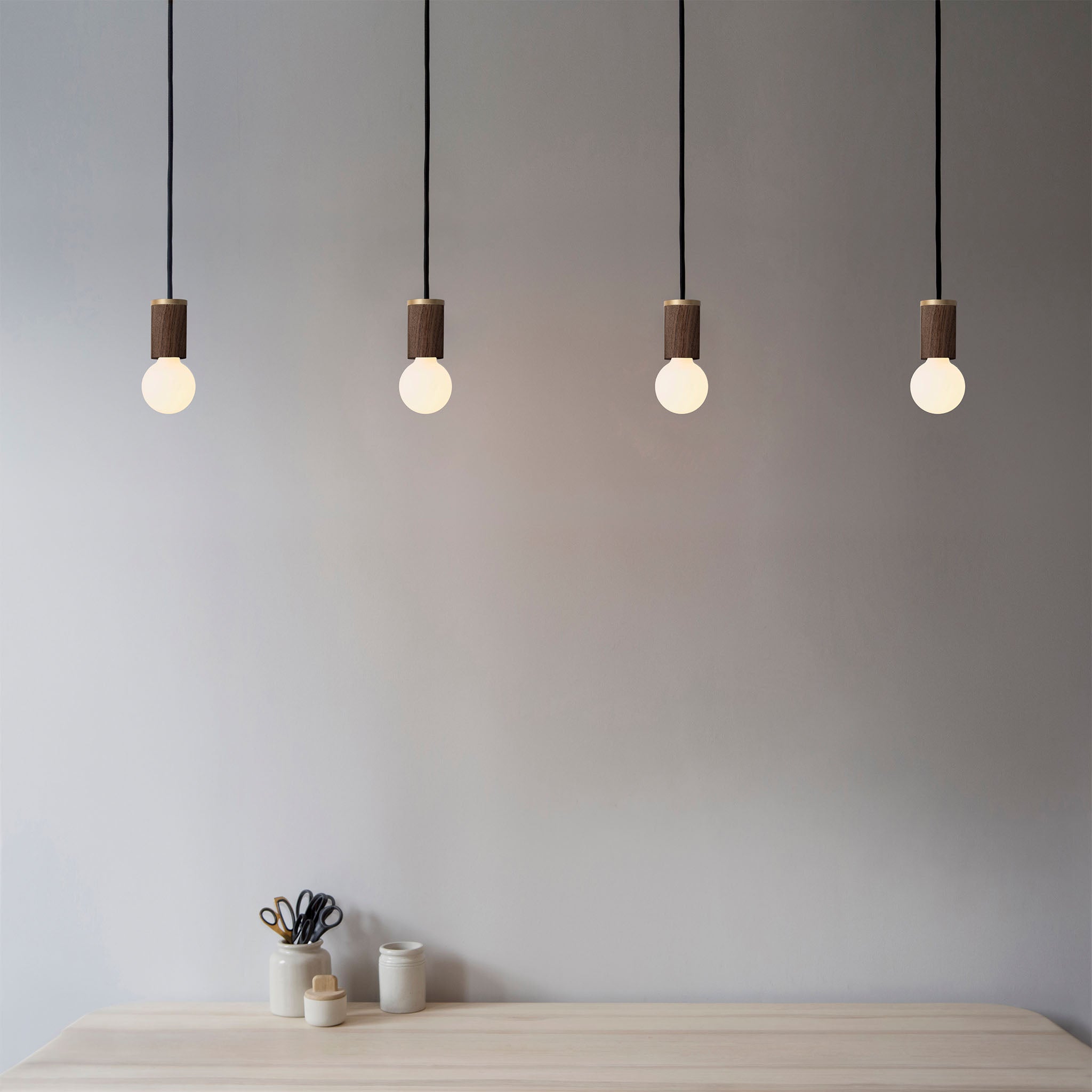 Tala Porcelain II Pendant Light in Walnut in a styled interior setting