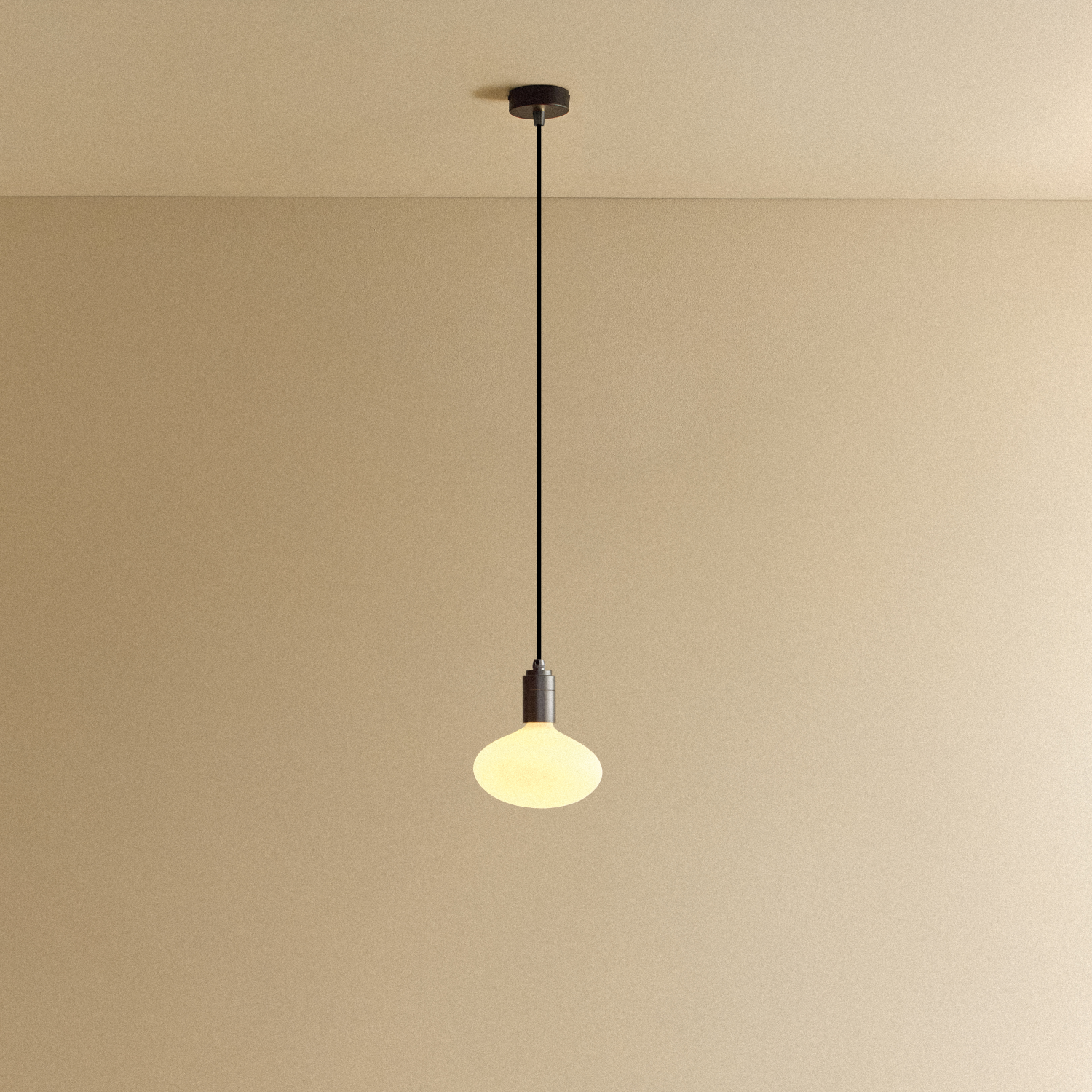 Tala Oval Dim-to-Warm Pendant Light in Graphite shown illuminated