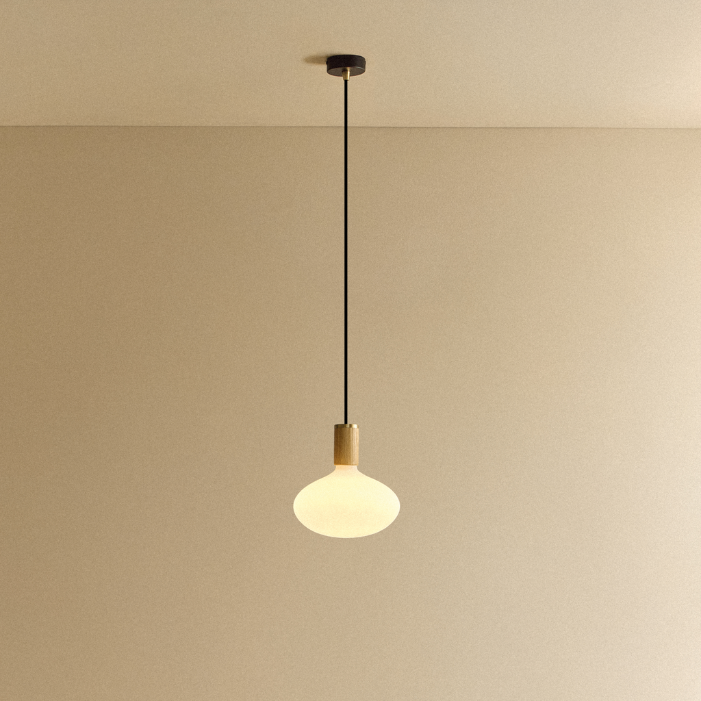 Tala Oval II Pendant Light in Oak shown illuminated