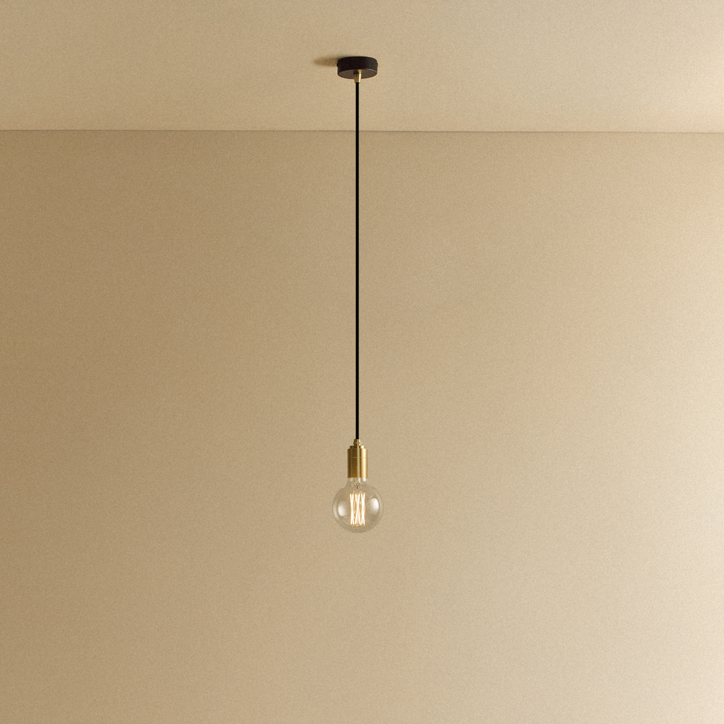 Tala Elva Pendant Light Non-Tinted in Brass shown illuminated