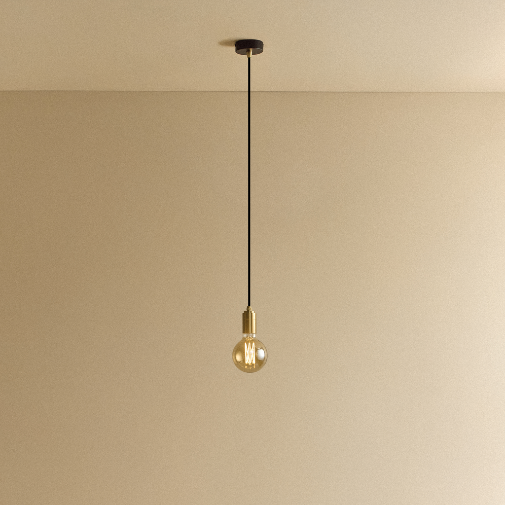 Tala Elva Pendant Light Tinted in Brass shown illuminated