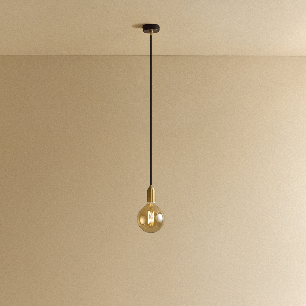Tala Gaia Pendant Light in Brass shown illuminated