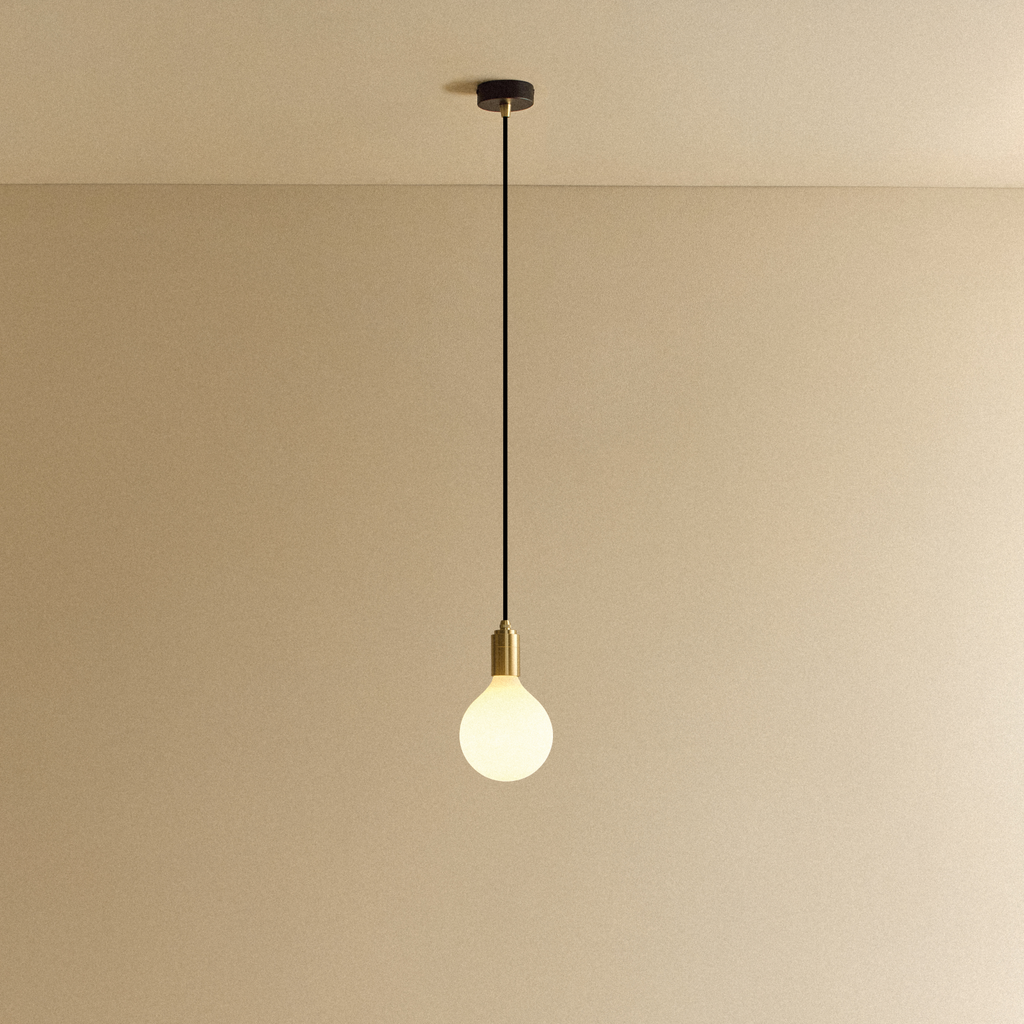Tala Porcelain III Pendant Light in Brass shown illuminated