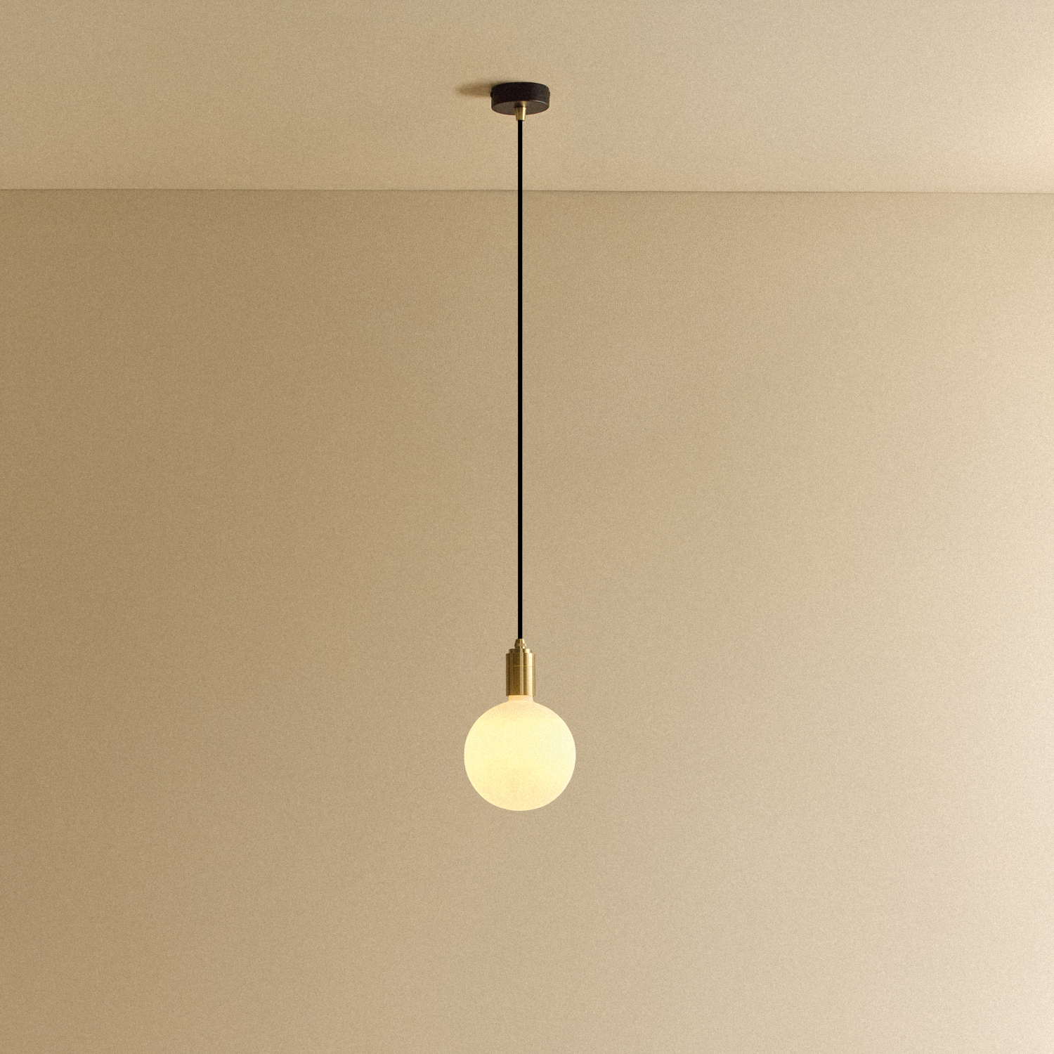 Tala Sphere IV Pendant Light in Brass shown illuminated