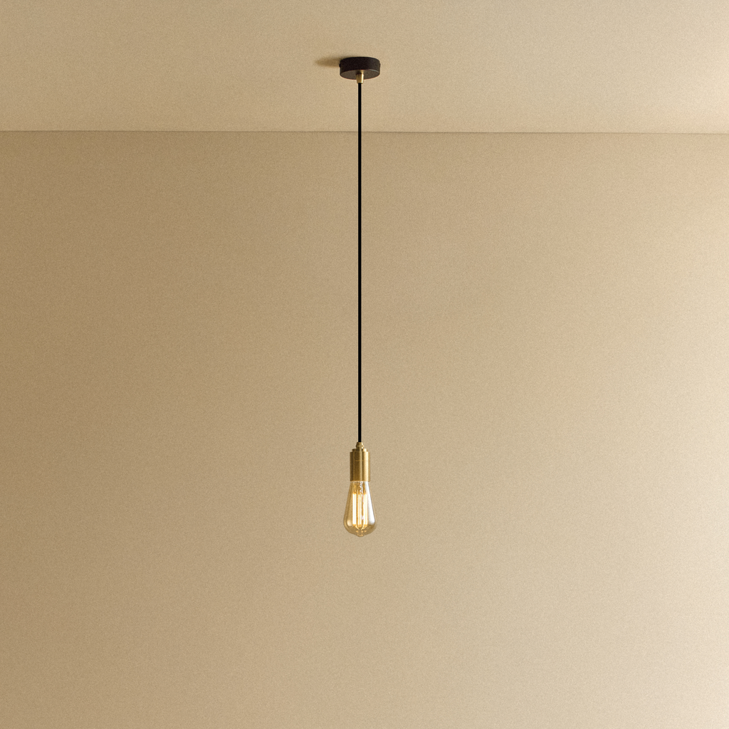 Tala Squirrel Cage Pendant Light in Brass shown illuminated
