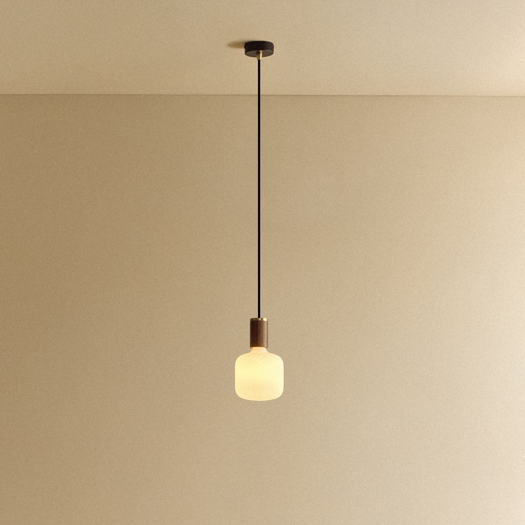 Tala Oblo Pendant Light in Walnut shown illuminated