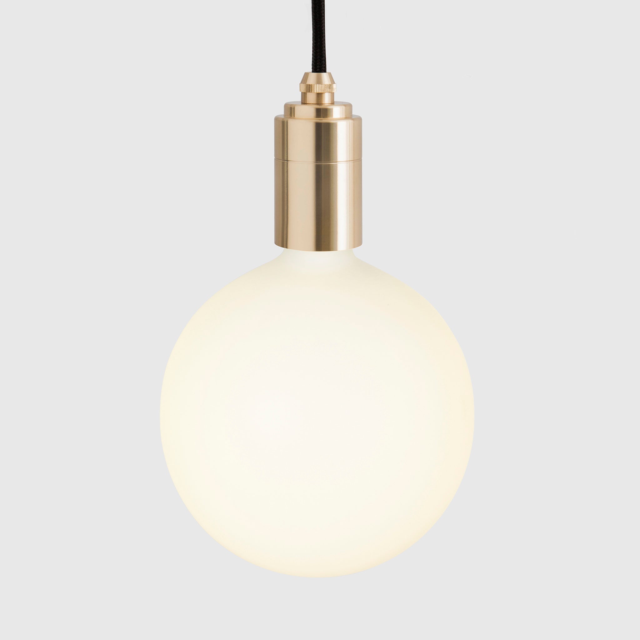 Tala Linear Triple Pendant in Brass + Sphere IV shown illuminated (view 2)