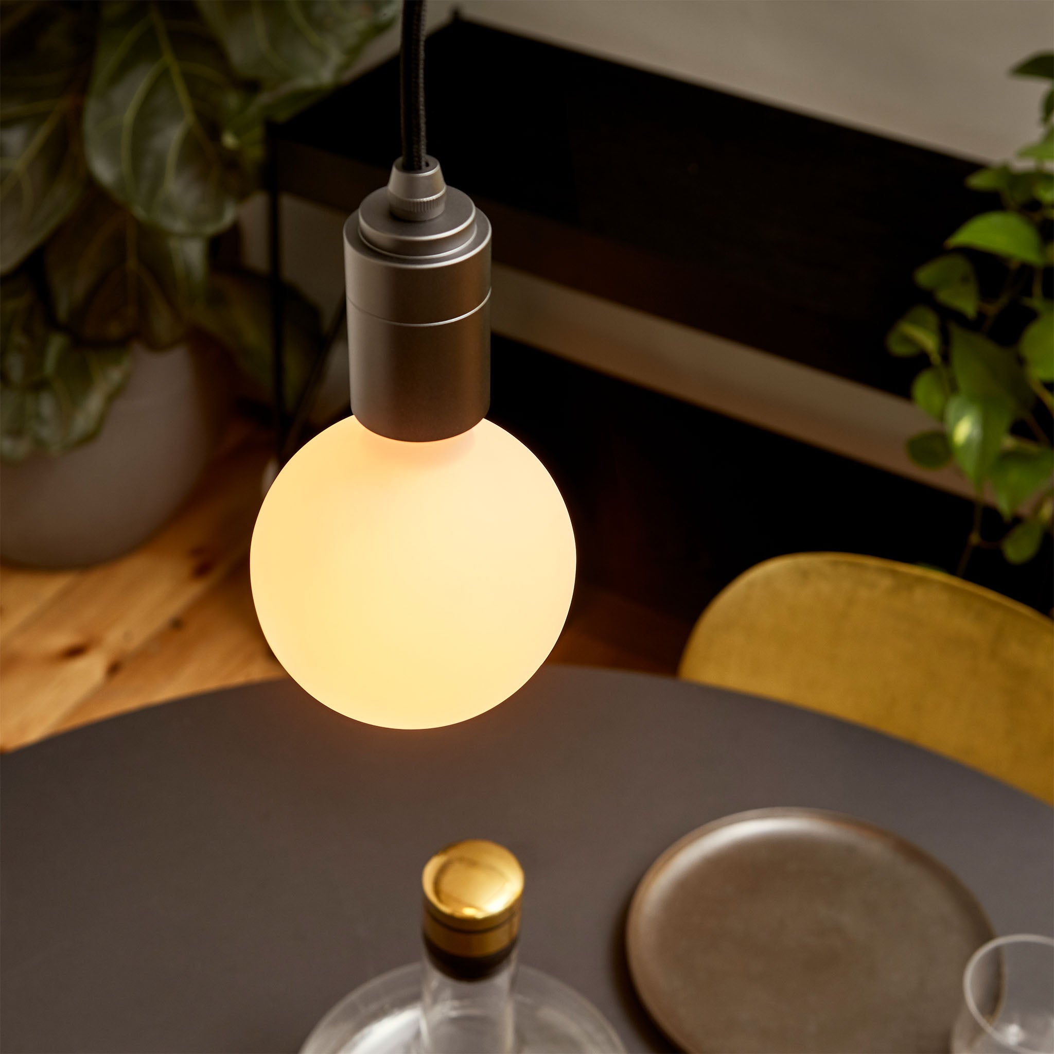 Tala Sphere III Pendant Light in Graphite in a styled interior setting (view 2)