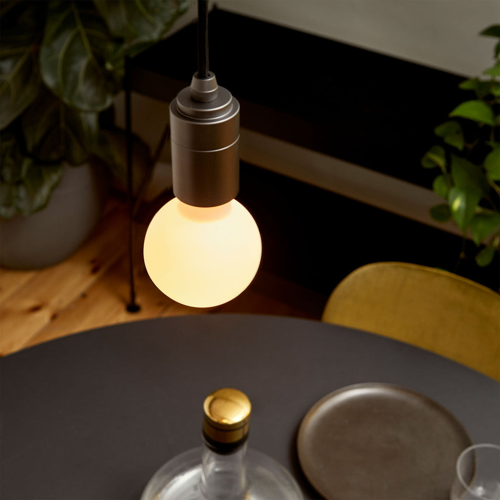 Tala Sphere II Pendant Light in Graphite in a styled interior setting