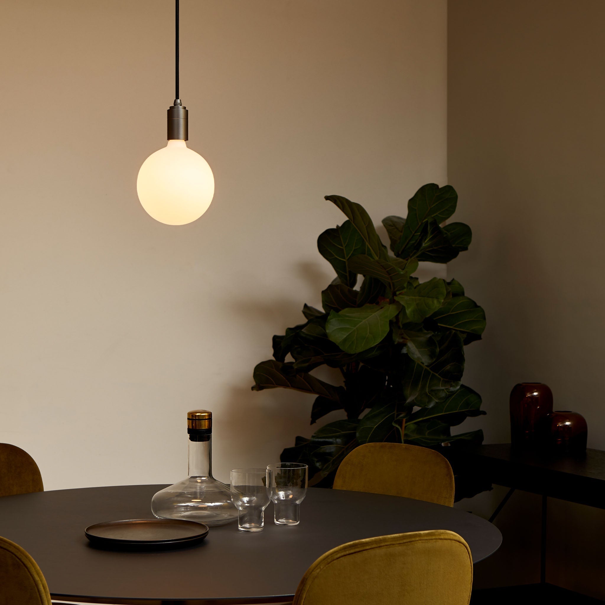 Tala Sphere IV Pendant Light in Graphite in a styled interior setting