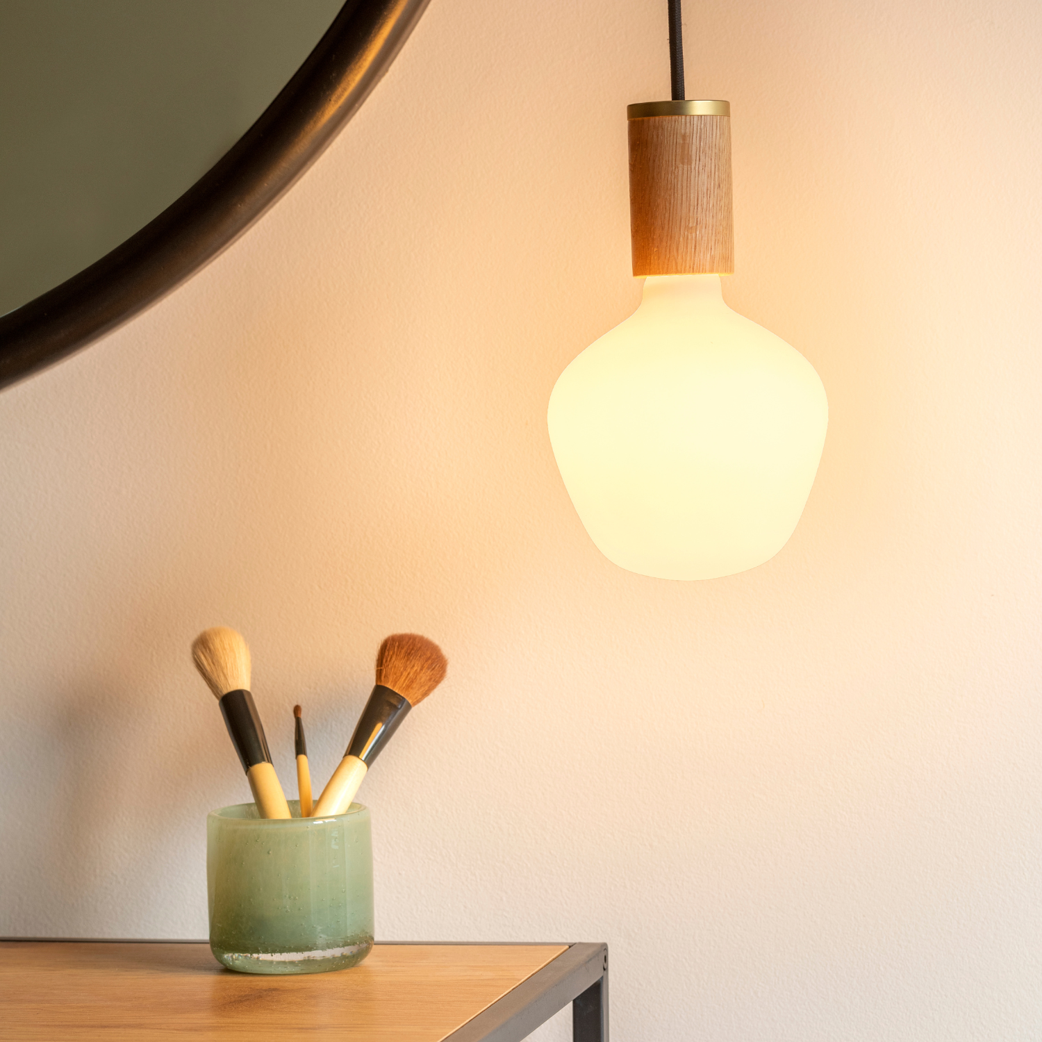 Tala Knuckle Pendant in Oak in a styled interior setting