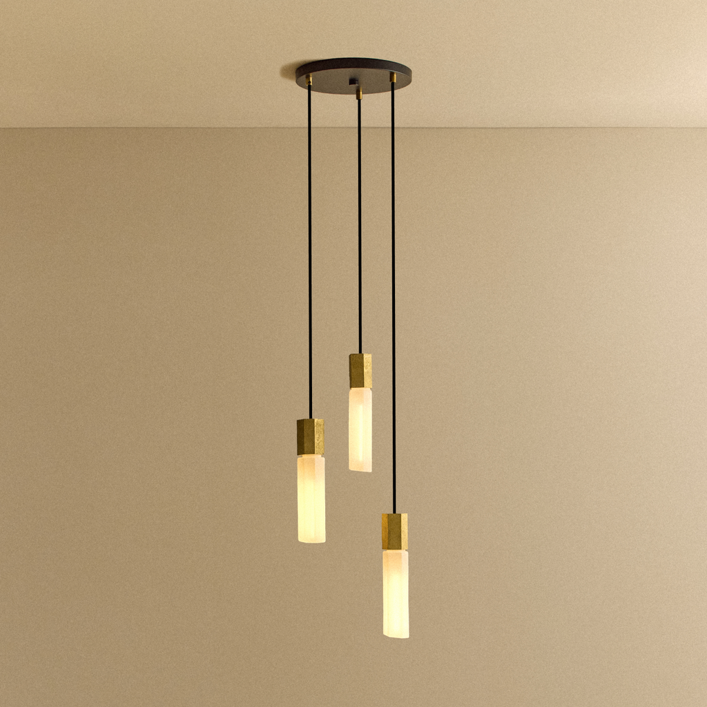 Tala Basalt Triple Pendant in Brass shown illuminated
