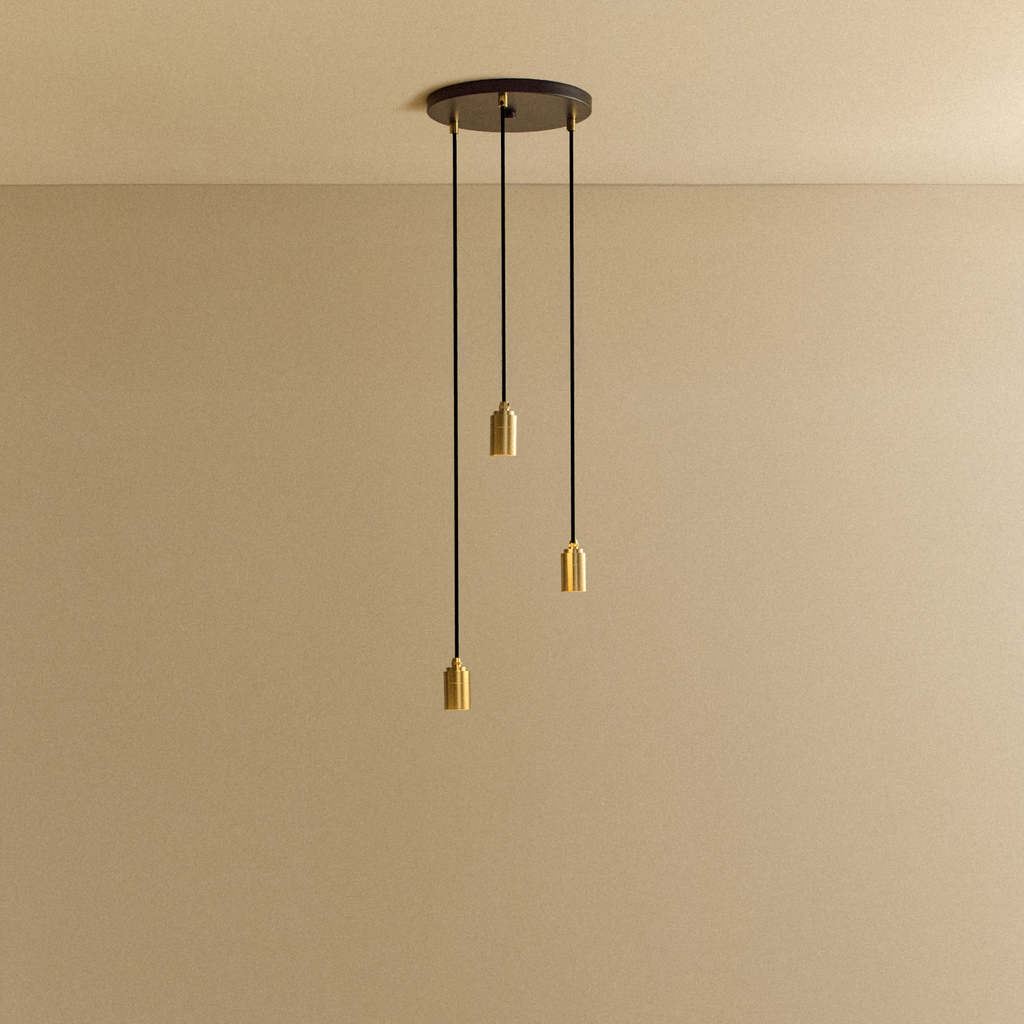 Tala Triple Pendant in Brass fixture shown without a bulb