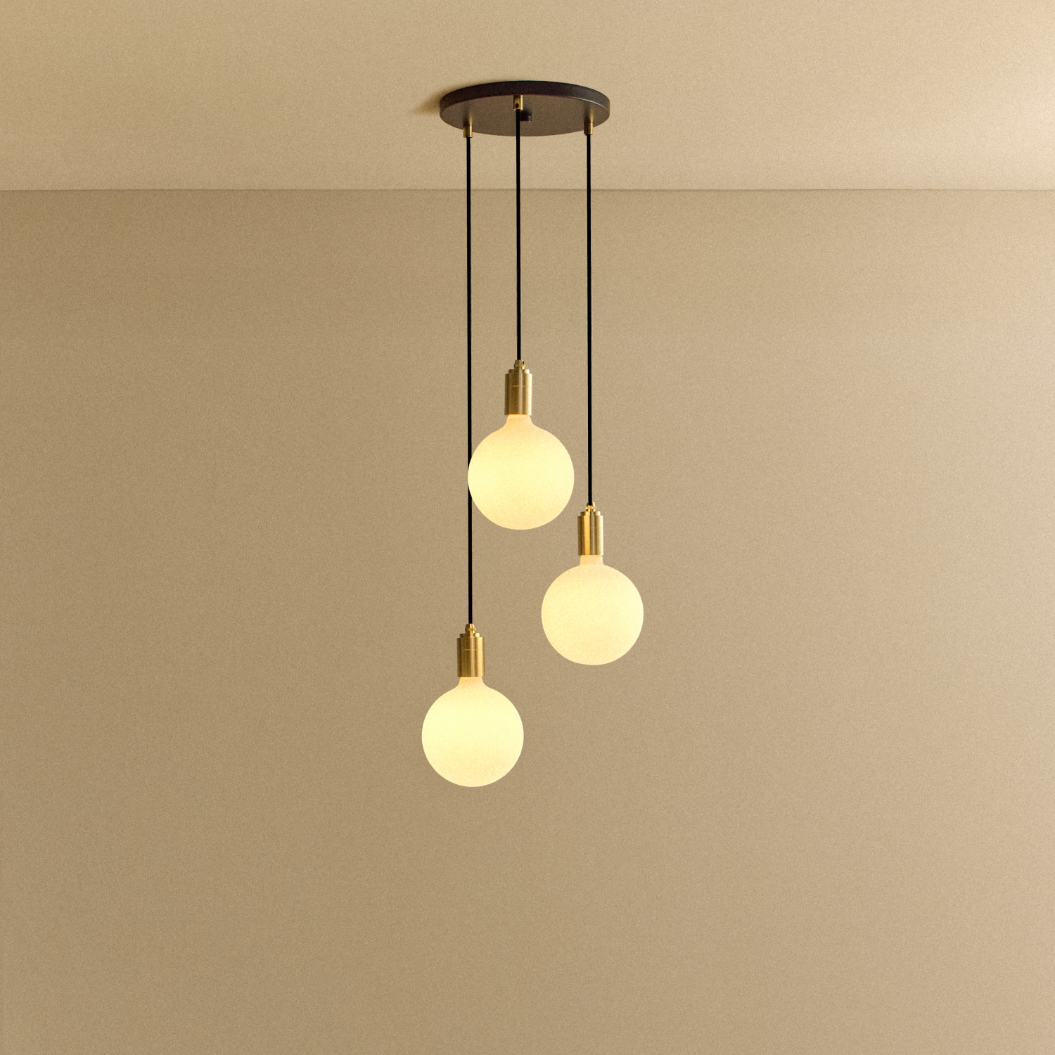Tala Triple Pendant in Brass + Sphere IV shown illuminated