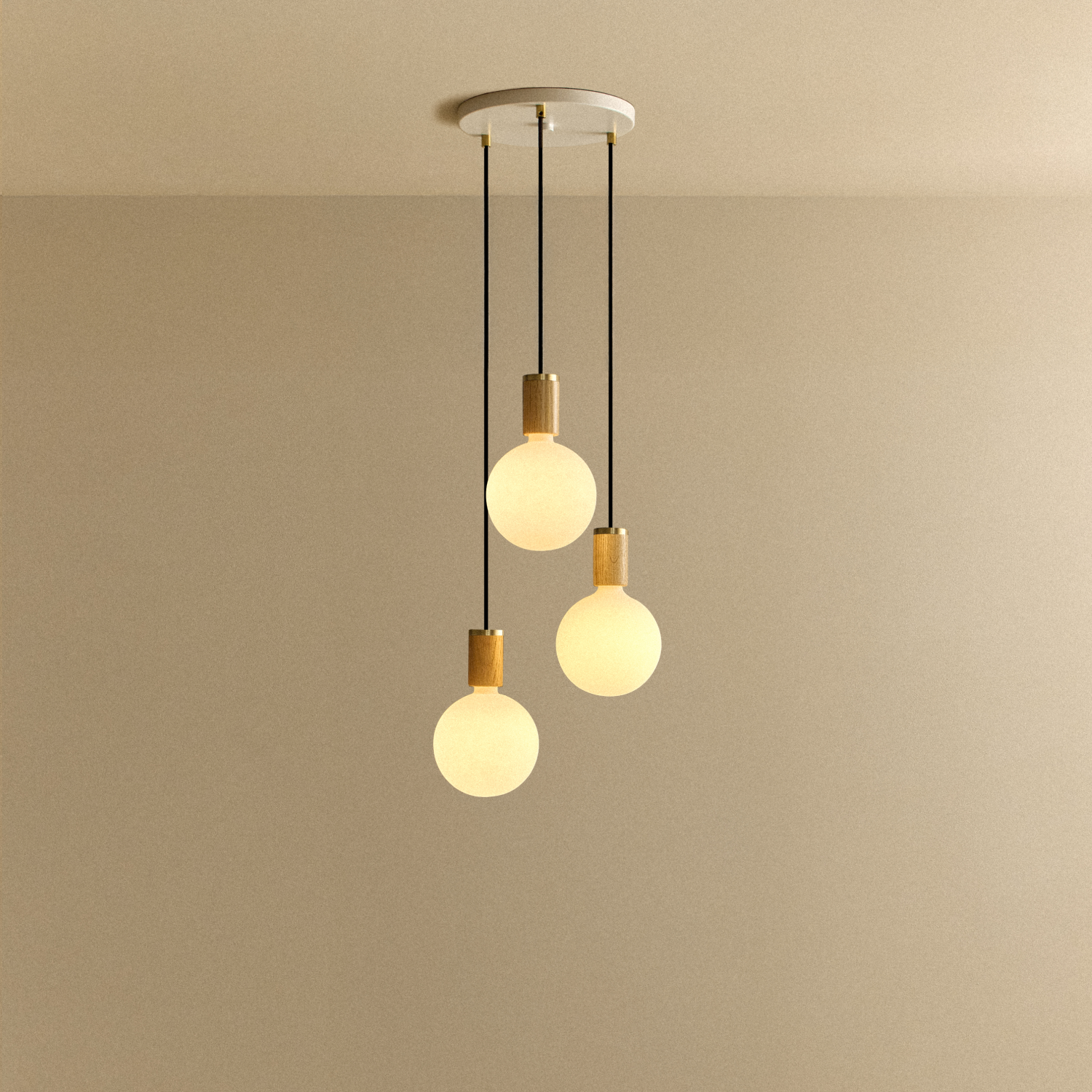 Tala Triple Pendant in Oak + Sphere IV shown illuminated