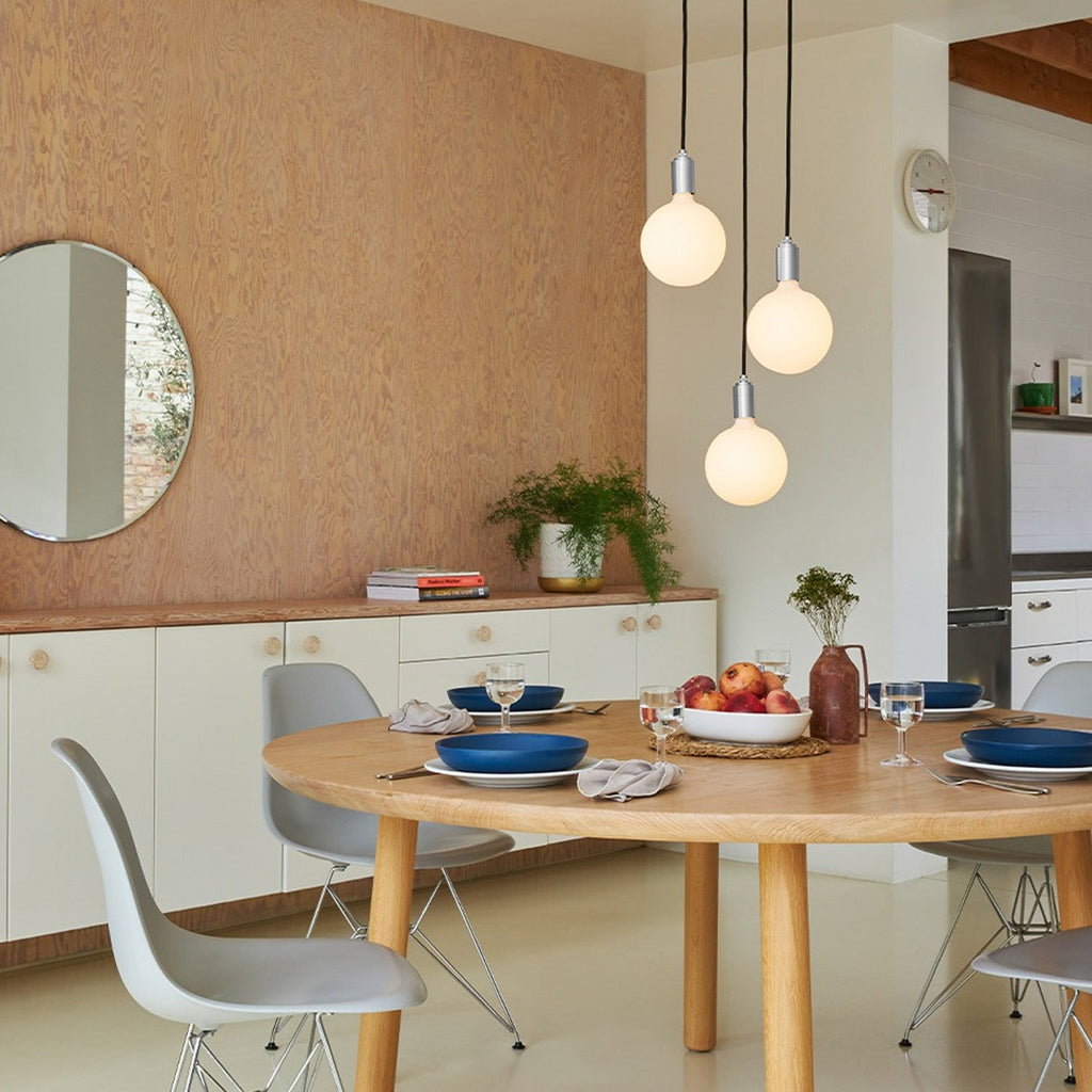 Tala Triple Pendant in Stainless Steel + Sphere IV in a styled interior setting