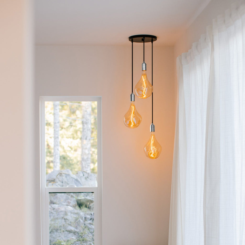 Tala Triple Pendant in Stainless Steel in a styled interior setting (view 2)