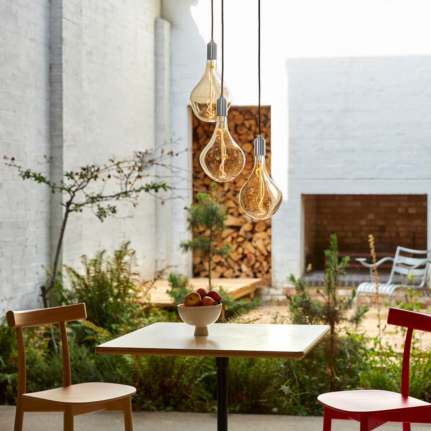 Tala Triple Pendant in Stainless Steel + Voronoi II in a styled interior setting