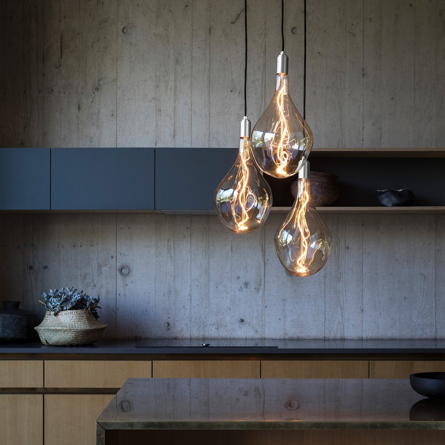 Tala Triple Pendant in Stainless Steel in a styled interior setting