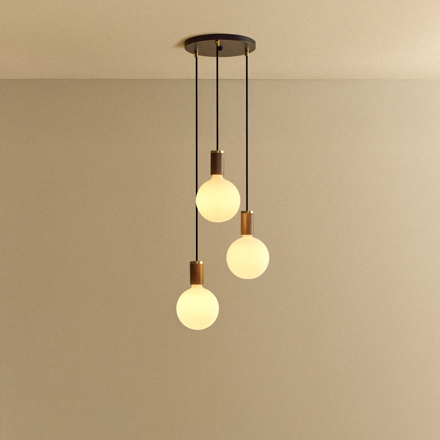 Tala Triple Pendant in Walnut + Sphere IV shown illuminated