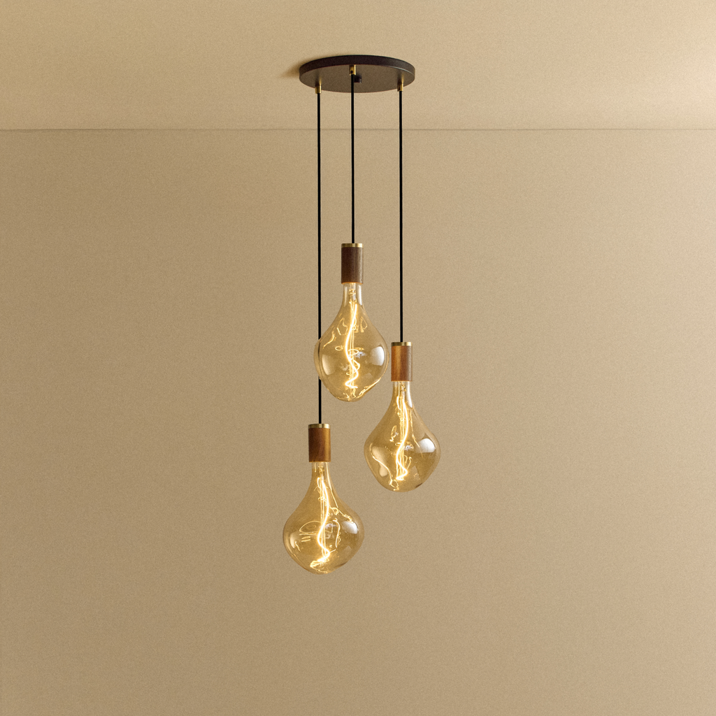 Tala Triple Pendant in Walnut + Voronoi II shown illuminated