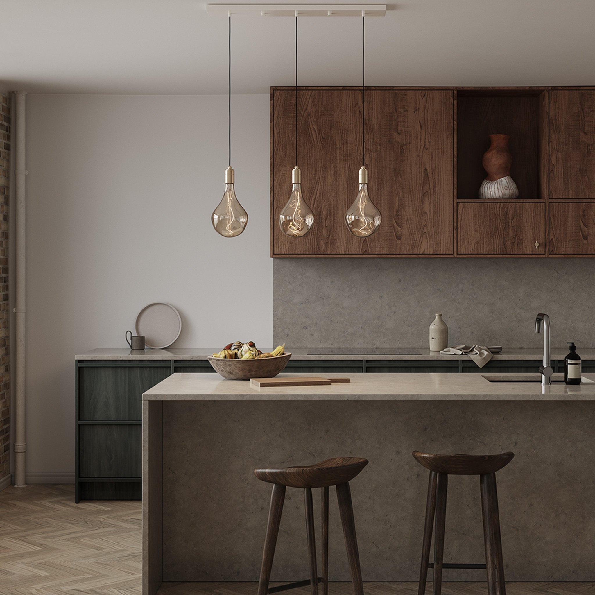 Tala Linear Triple Pendant in Brass in a styled interior setting
