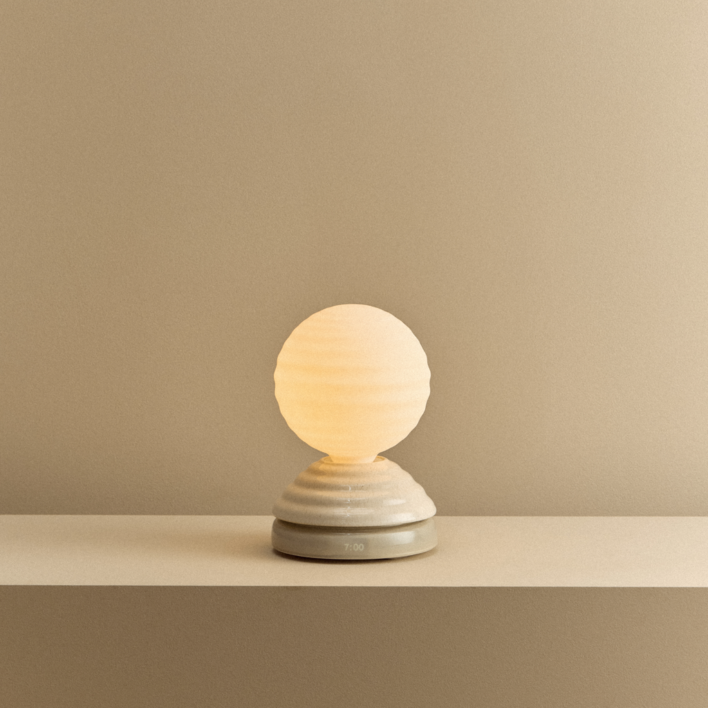 Tala Wake Sleep Light in Pebble White shown illuminated