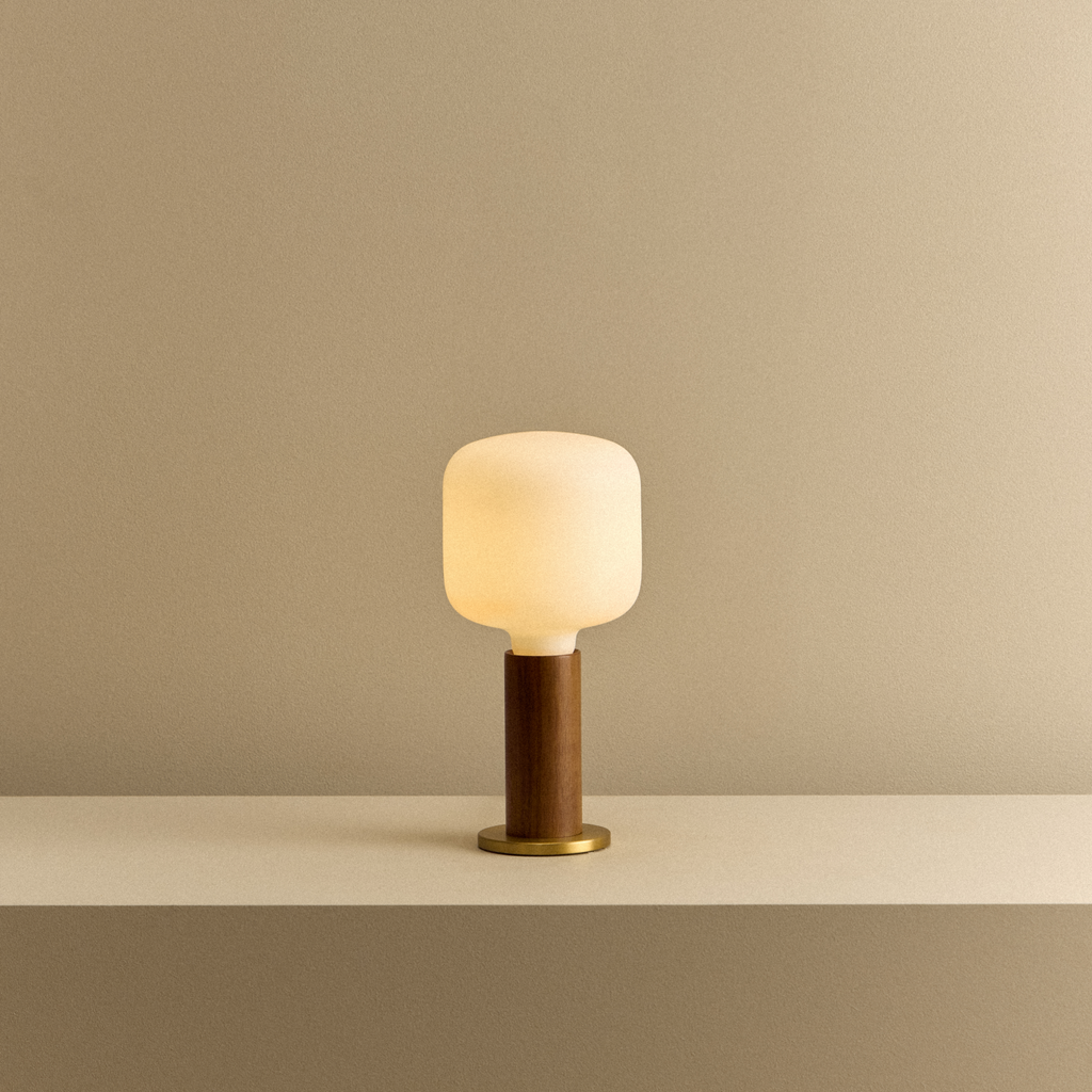 Tala Knuckle Table Lamp in Walnut + Oblo shown illuminated