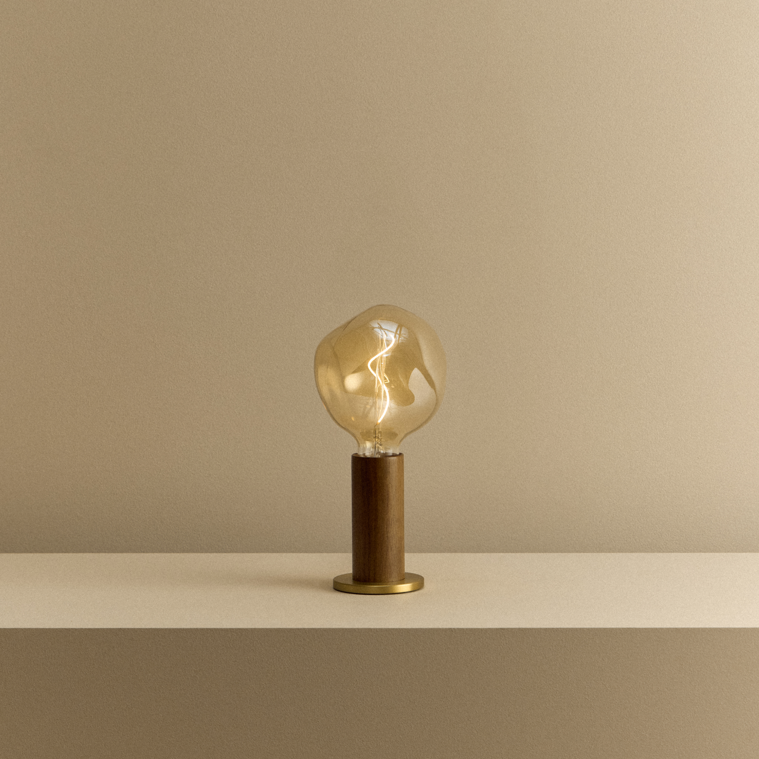 Tala Knuckle Table Lamp in Walnut + Voronoi I shown illuminated