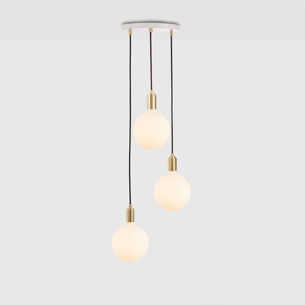 Tala Triple Pendant in Brass + Sphere IV shown illuminated (view 2)