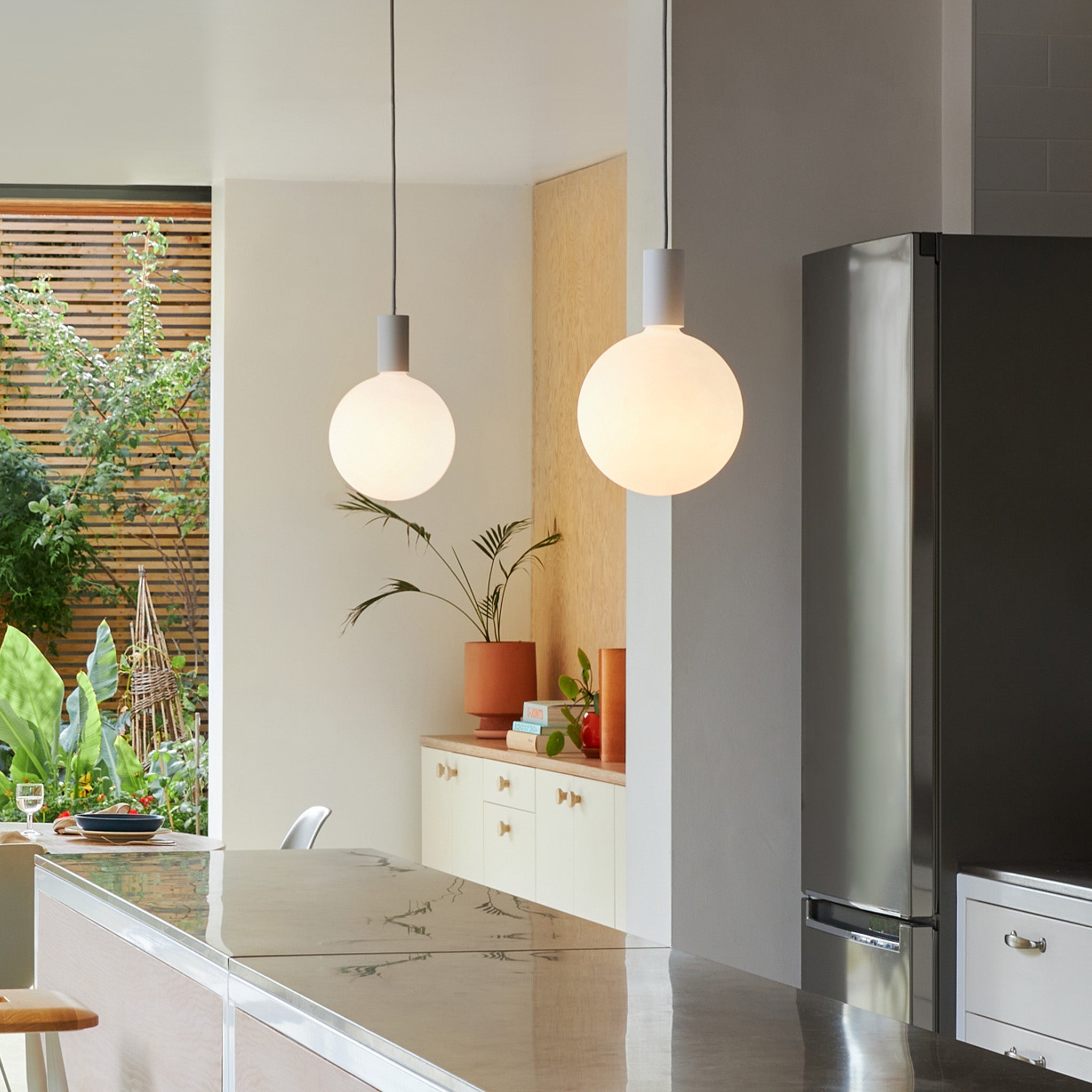 Tala Alumina Single Pendant + Sphere V in a styled interior setting